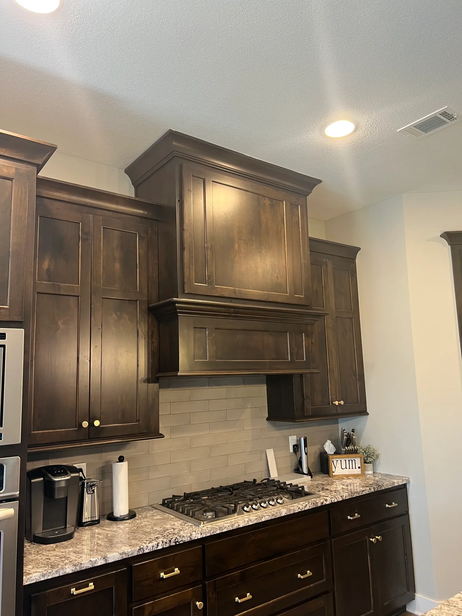 Dark stained kitchen cabinets detail