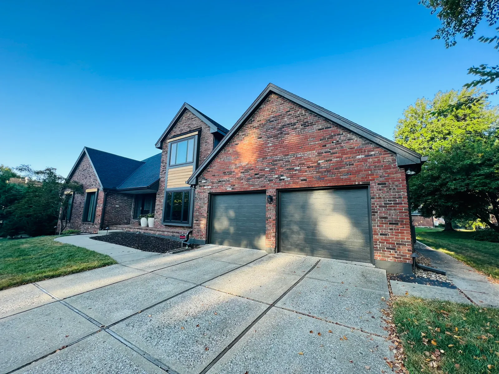 Brick home with painted garage