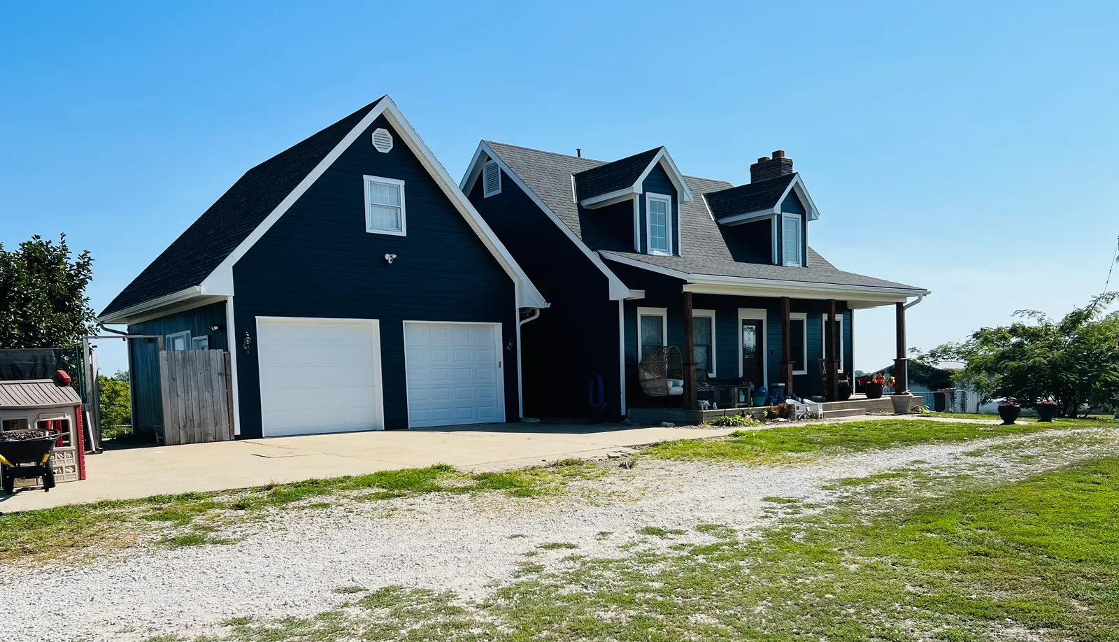 Finished navy farmhouse with white trim