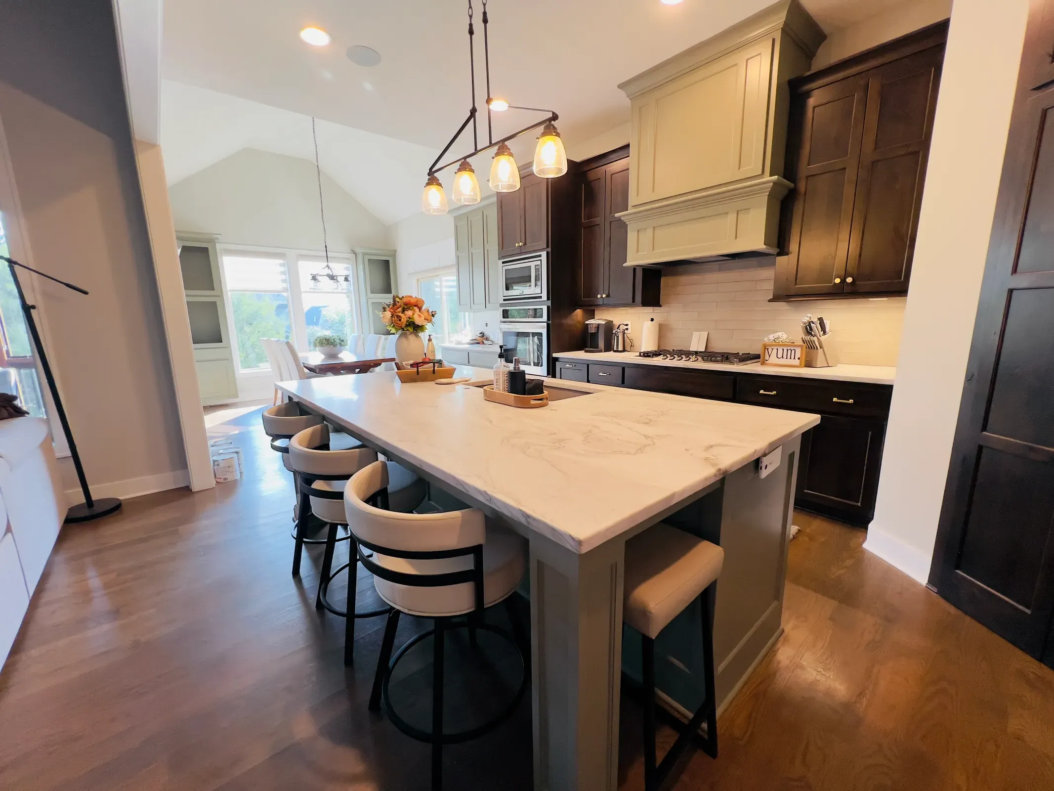 Kitchen with dark painted cabinets and island